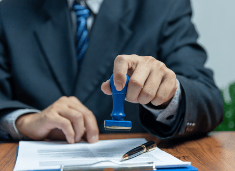 Man stamping a document