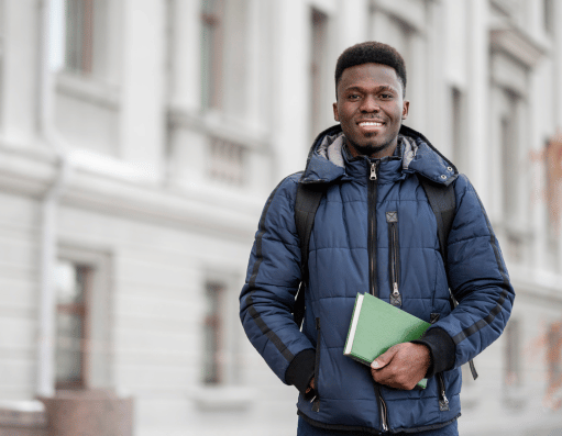 A student abroad holding a book